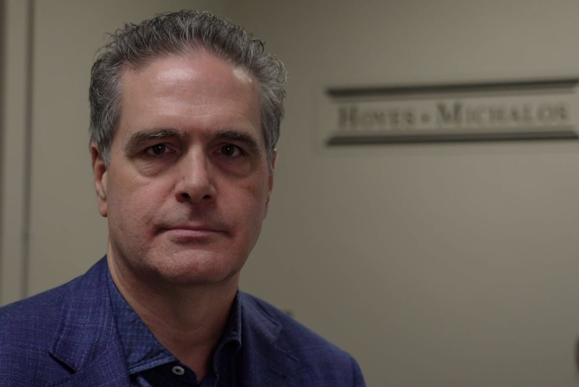 insolvency-trustee-doug-hoyes A man in a blue blazer looks directly into the camera.