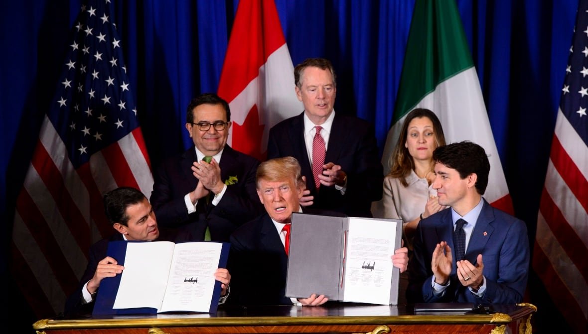 Prime Minister Justin Trudeau, right to left, Foreign Affairs Minister Chrystia Freeland, United States Trade Representative Robert Lighthizer, President of the United States Donald Trump, Mexico's Secretary of Economy Ildefonso Guajardo Villarreal, and President of Mexico Enrique Pena Nieto participate in a signing ceremony for the new United States-Mexico-Canada Agreement in Buenos Aires, Argentina on Friday, Nov. 30, 2018.