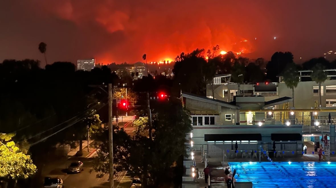 A swimming pool with L.A. fires raging in background.