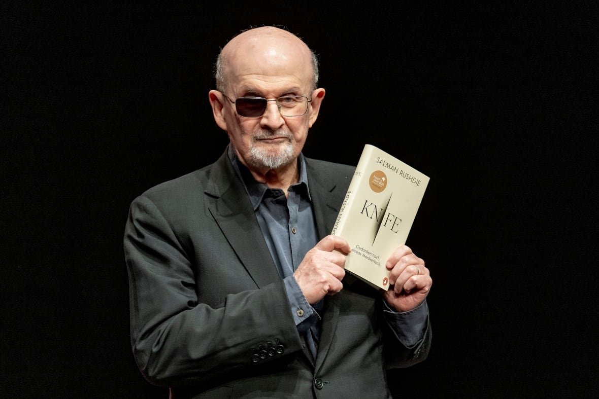 Salman Rushdie poses for a portrait to promote his book "Knife: Meditations After an Attempted Murder", at the Deutsches Theater in Berlin.