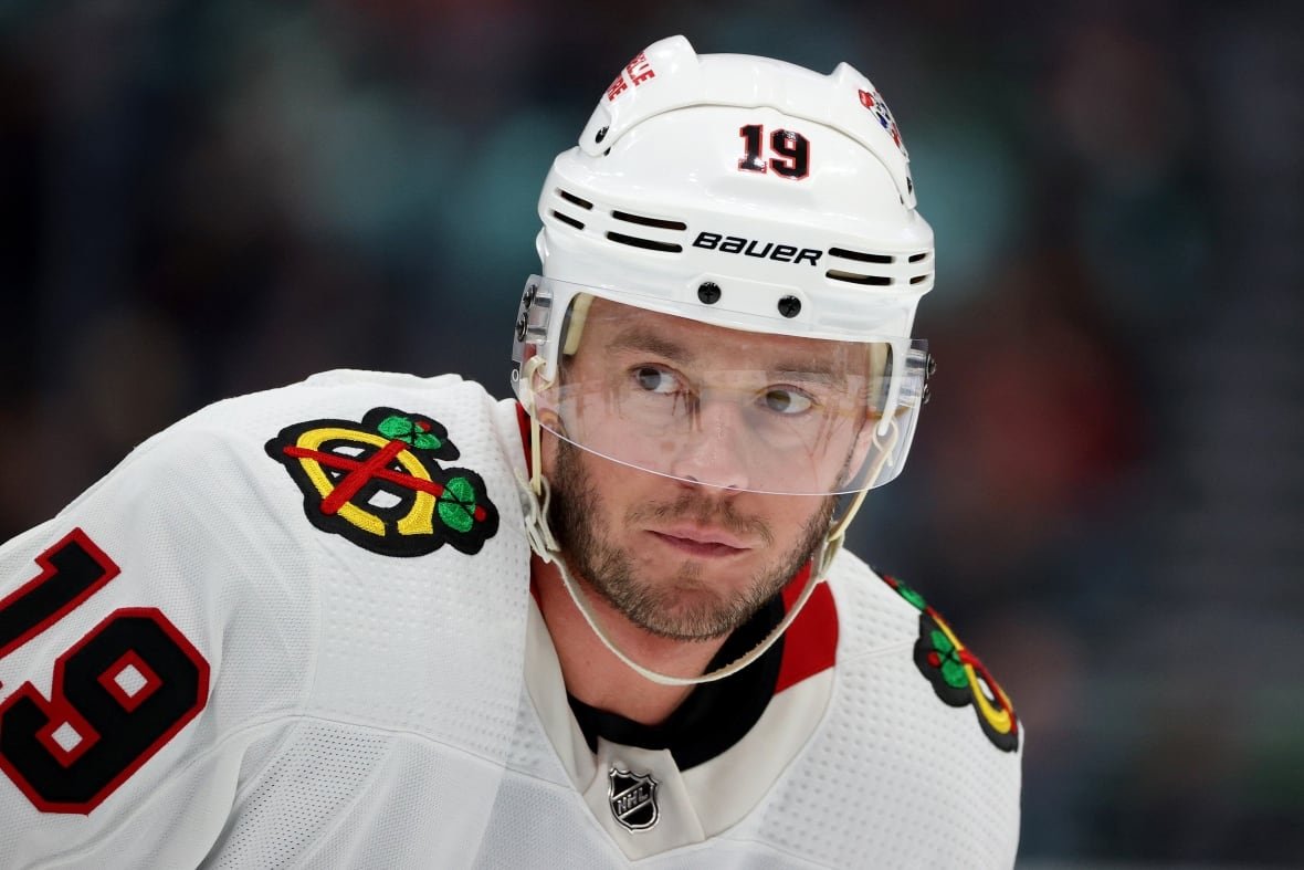 1481229870 A close up of a male ice hockey player wearing number 19.