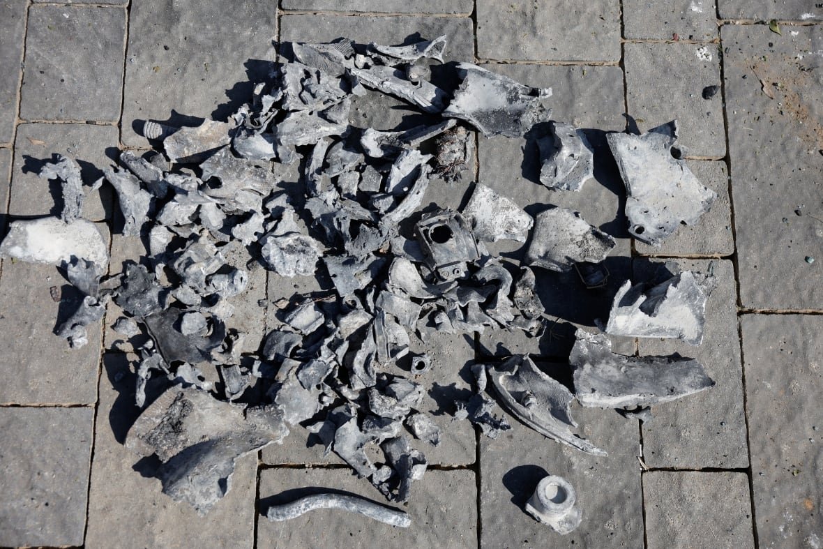 iran-nuclear-israel-4 Fragments of a grey coloured metal are shown on the ground