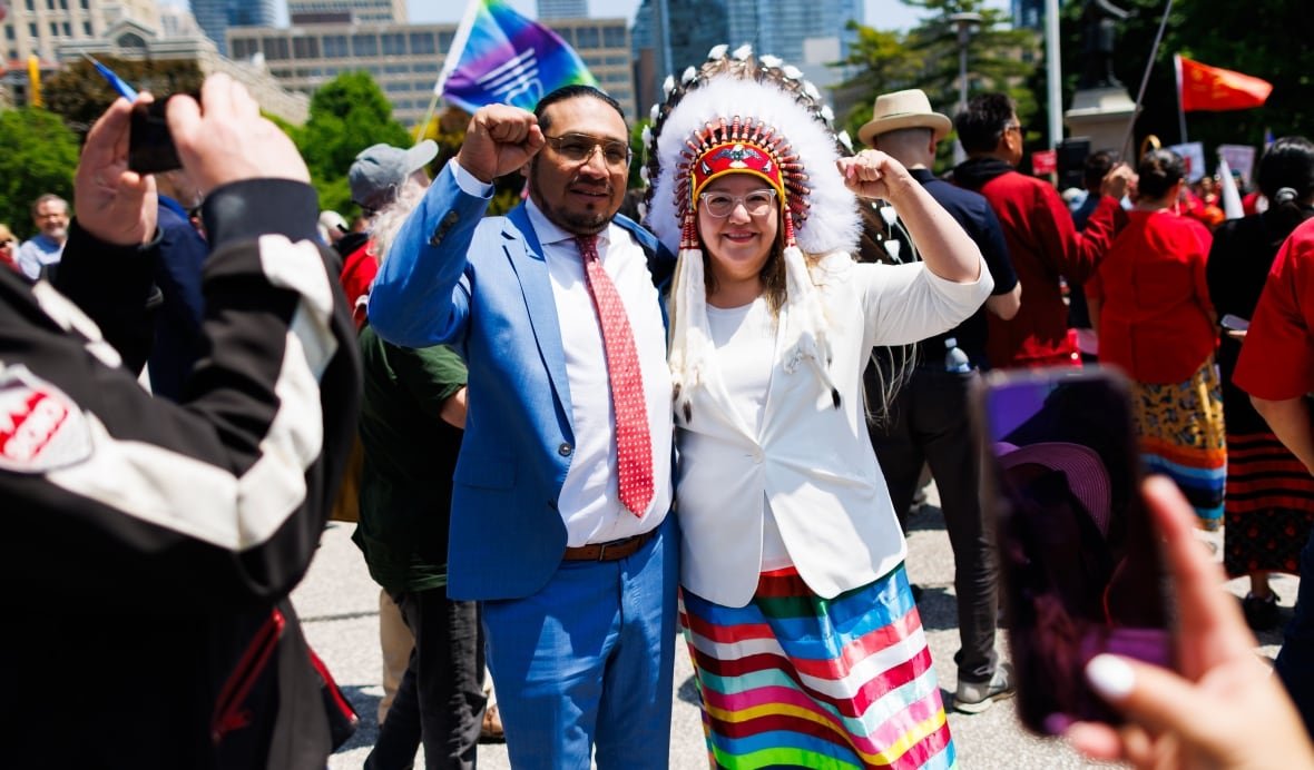 ont-debates-20250602-4 NDP MPP Sol Mamakwa, left, takes a photo with AFN National Chief Cindy Woodhouse during a demonstration opposing Bill 5, outside the Ontario Legislature at Queen's Park in Toronto on Monday.