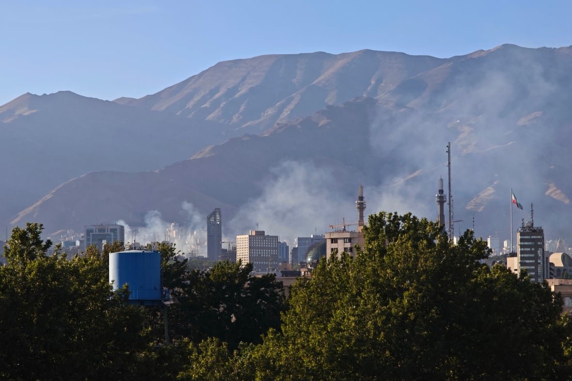 smoke-rises-in-tehran-after-reported-israeli-strike-on-police-headquarters Smoke rises in Tehran, Iran, after a reported Israeli strike on Tehran's police headquarters on June 18.