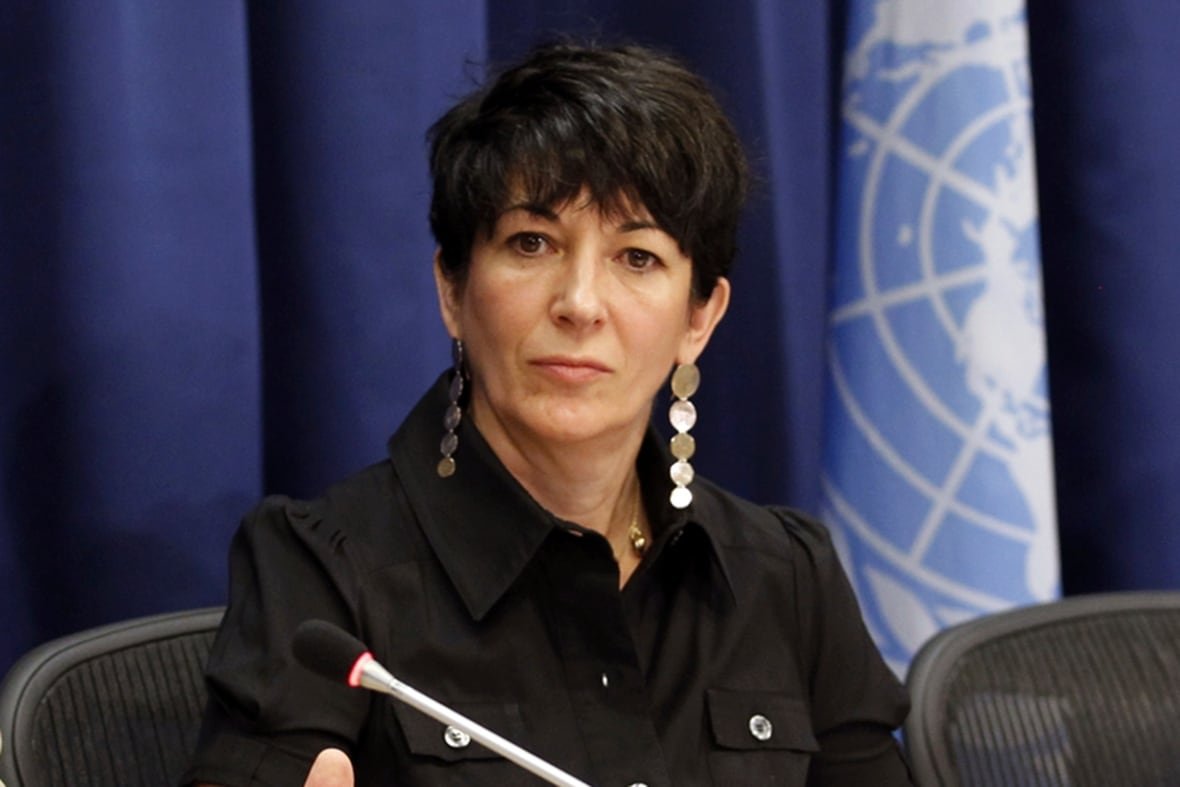 jeffrey-epstein-maxwell-trial Woman with short, dark hair and dressed in dark clothing with long hanging earrings, sits looking pensive
