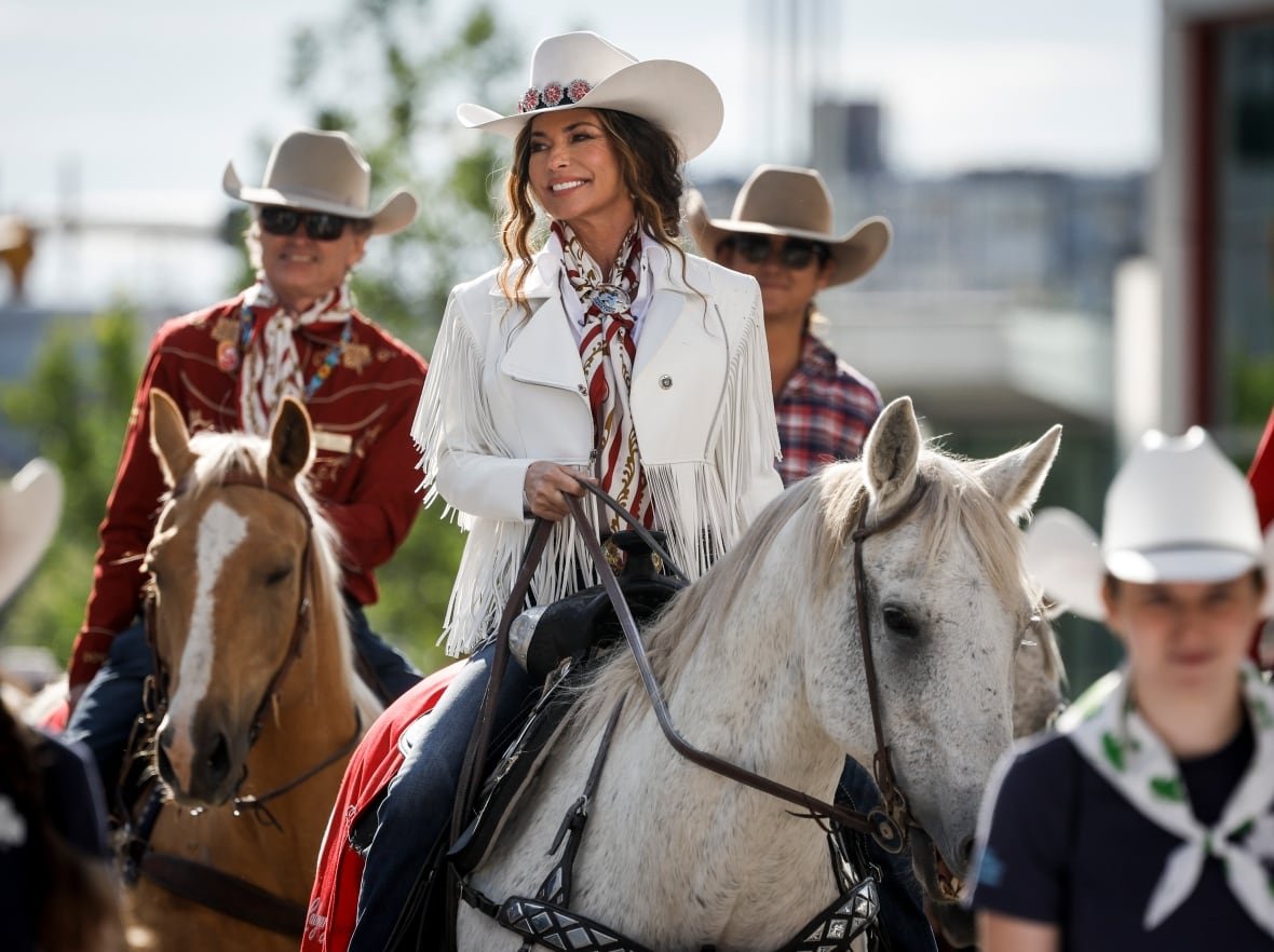 stampede-parade-20250704 Parade Marshal Shania Twain, centre, rides a horse during the Calgary Stampede parade in Calgary.