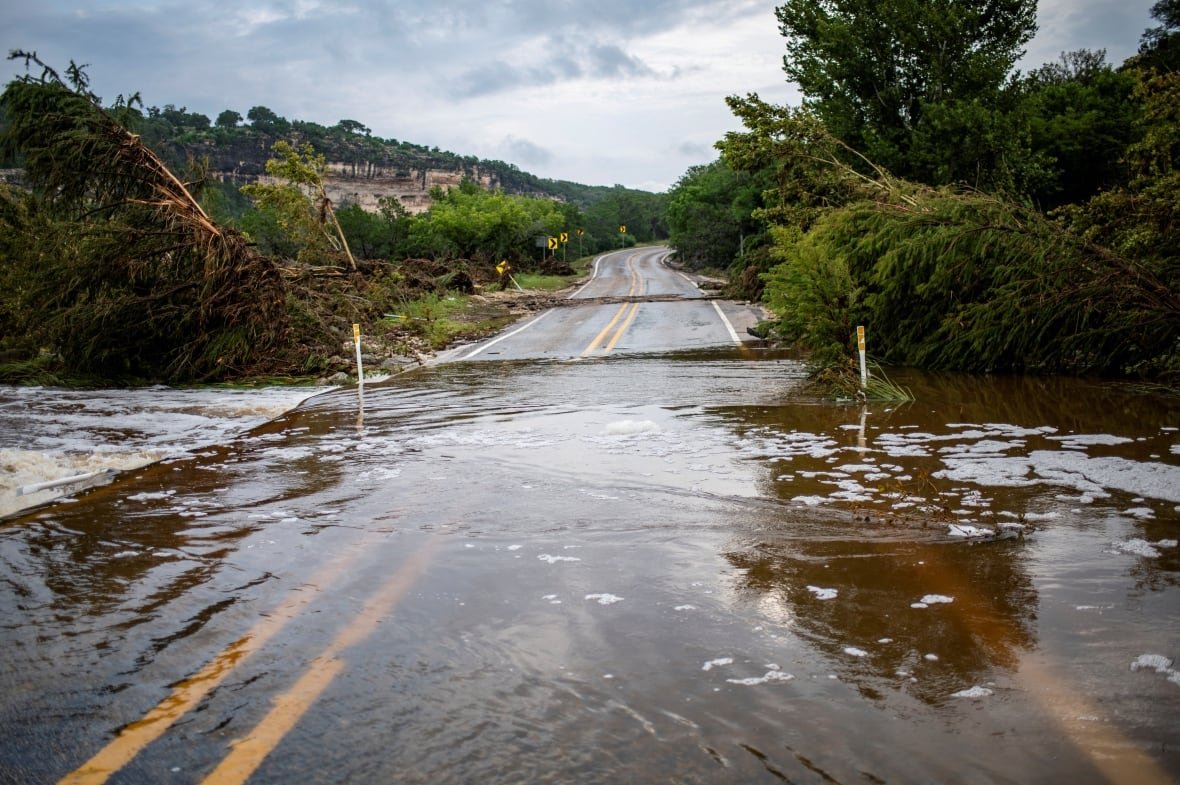 usa-weather-texas-flooding-5 A road is seen flooded.