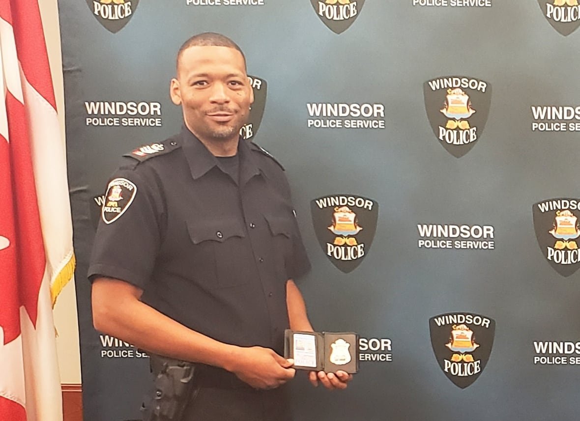 windsor-police-service A police officer poses with his badge.