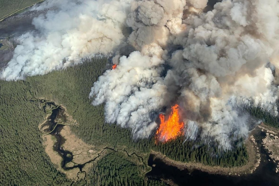 Aerial view depicting a wildfire in southern Dawson Creek, British Columbia, with smoke billowing across the sky.