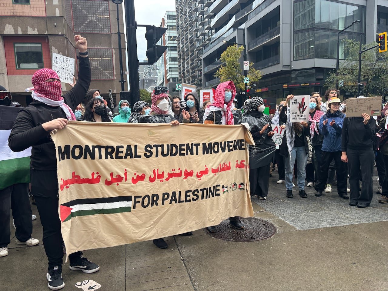 default-791 Demonstrators holding a sign for Montreal Student Movement for Palestine.