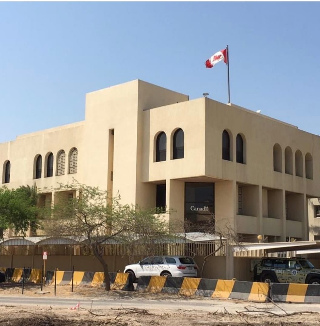An embassy featuring a Canadian flag.