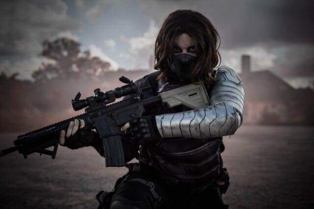 default-333 A person holding a gun with a metallic-looking arm