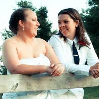 default-59 two women in wedding attire smiling at each other